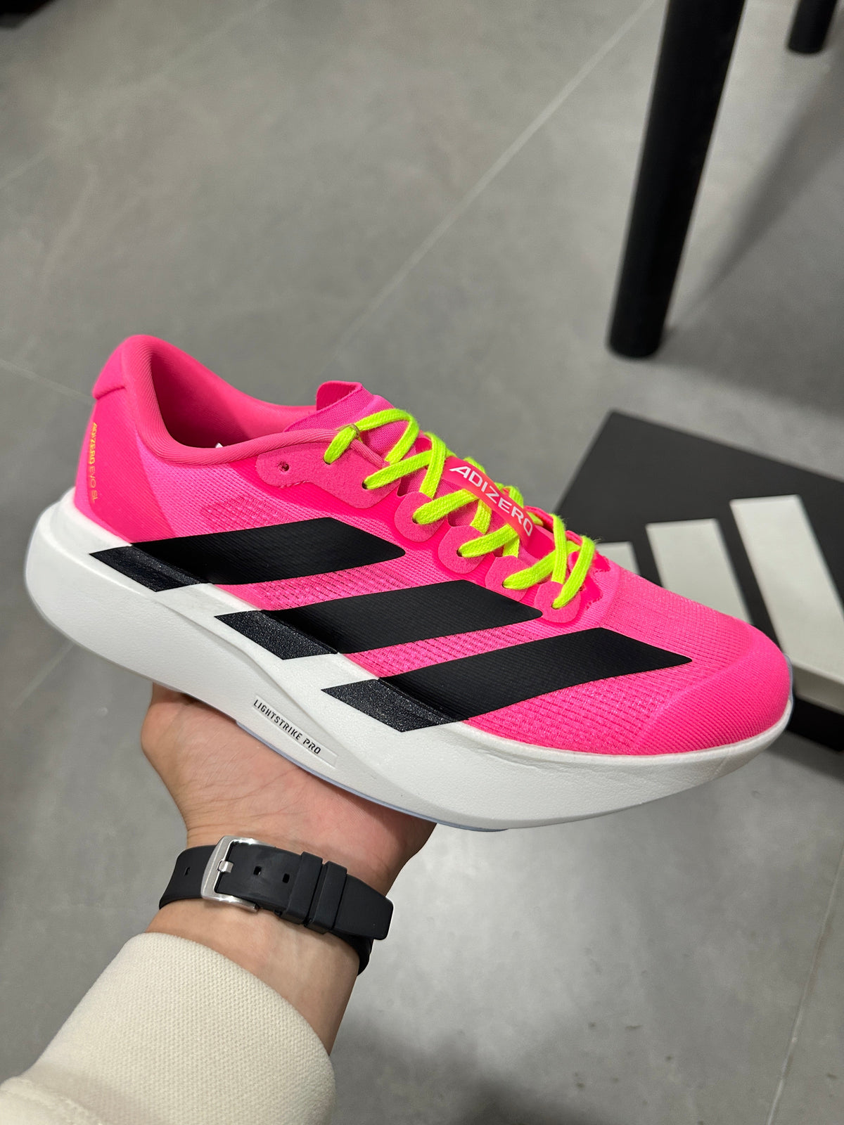Adidas Adizero Lightstrike Pro Running Shoes in Pink - product image from the listing.