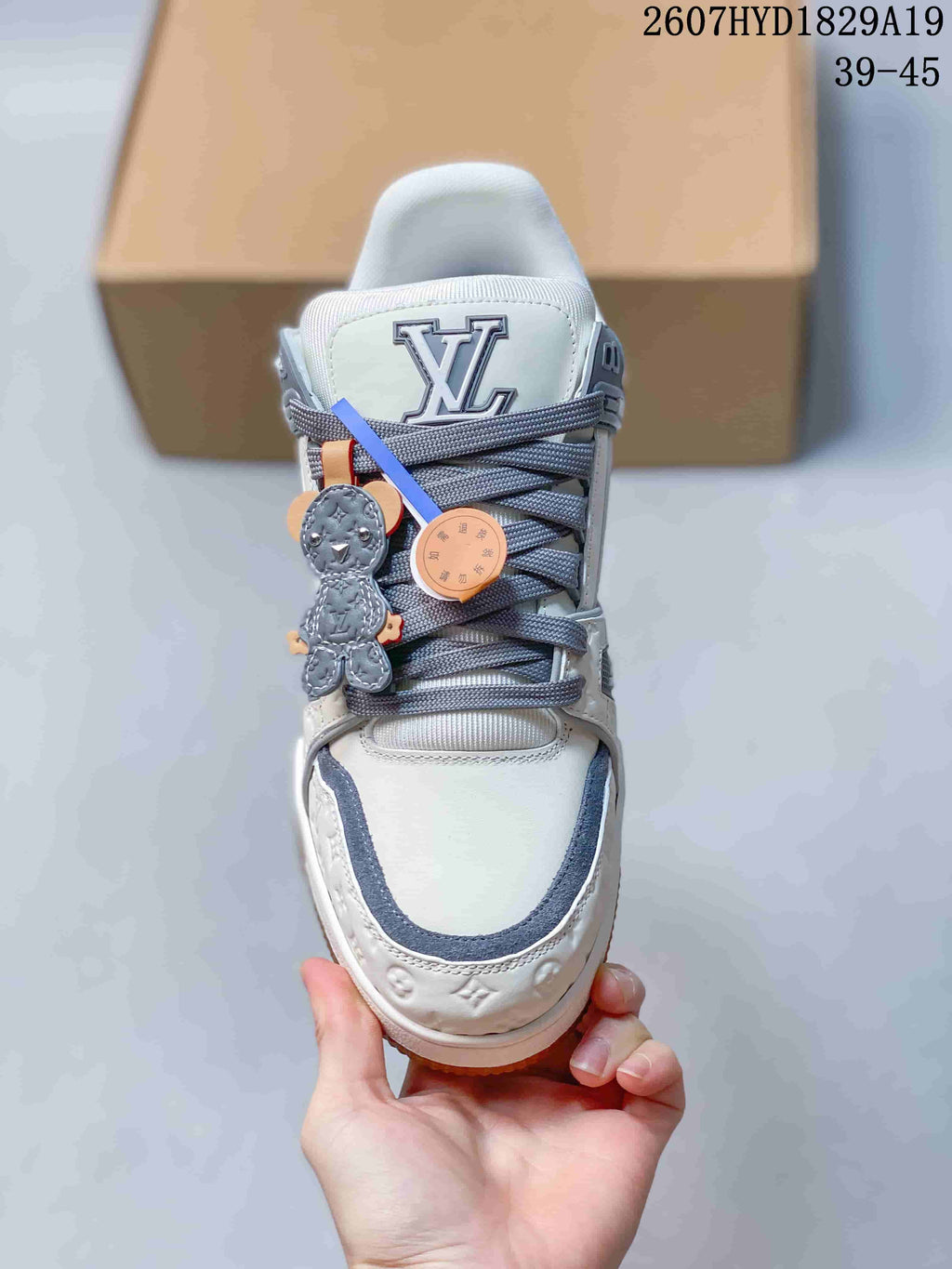 Louis Vuitton Trainer Maxi Low-Top Sneakers in White Gray - product image from the listing.