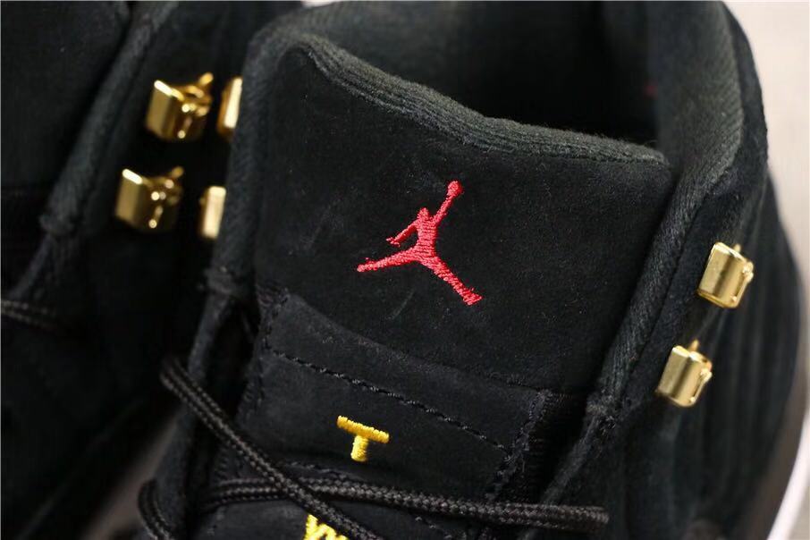 Air Jordan 12 Reverse Taxi Sneakers Black 153265-017 - product image from the listing.