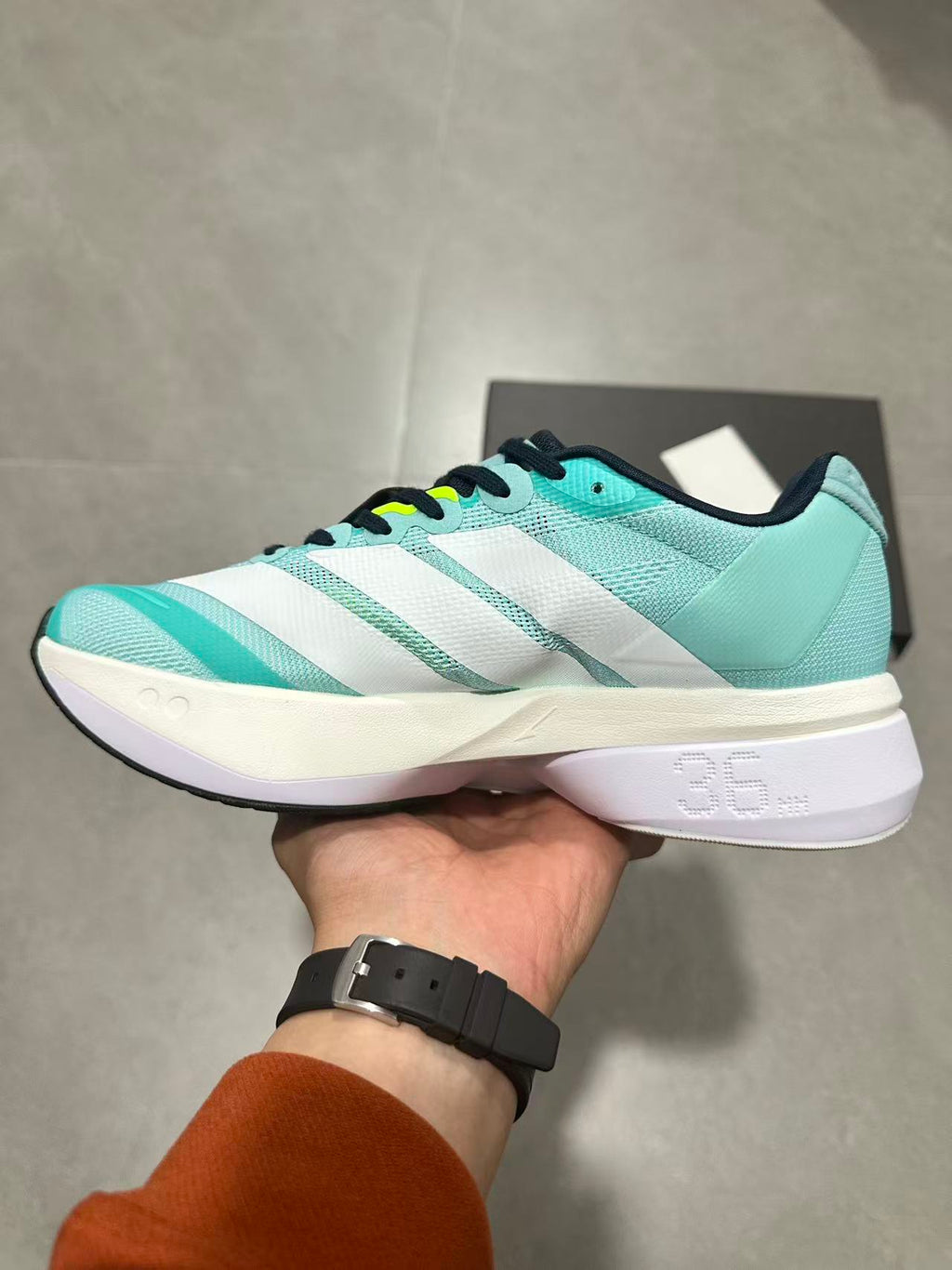 adidas Adizero Lightstrike Pro Running Shoes, in Mint and Black - product image from the listing.