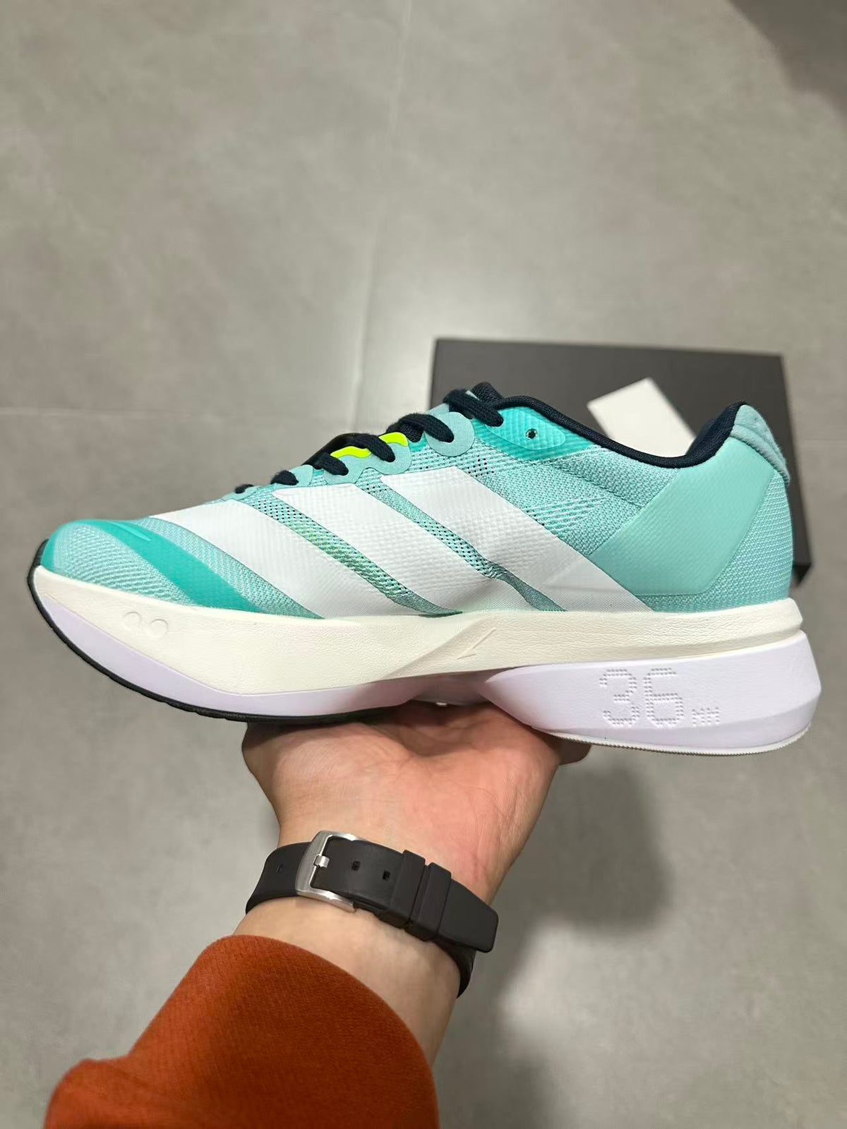 adidas Adizero Lightstrike Pro Running Shoes, in Mint and Black - product image from the listing.