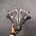 Grey Jordan 4 KAWS Sample High-Top Sneakers - product image from the listing.