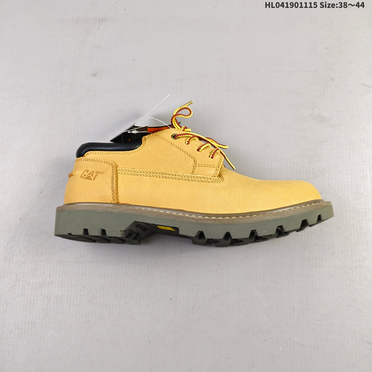 CAT Low-Top Lace-Up Work Boots in Honey in Yellow - product image from the listing.