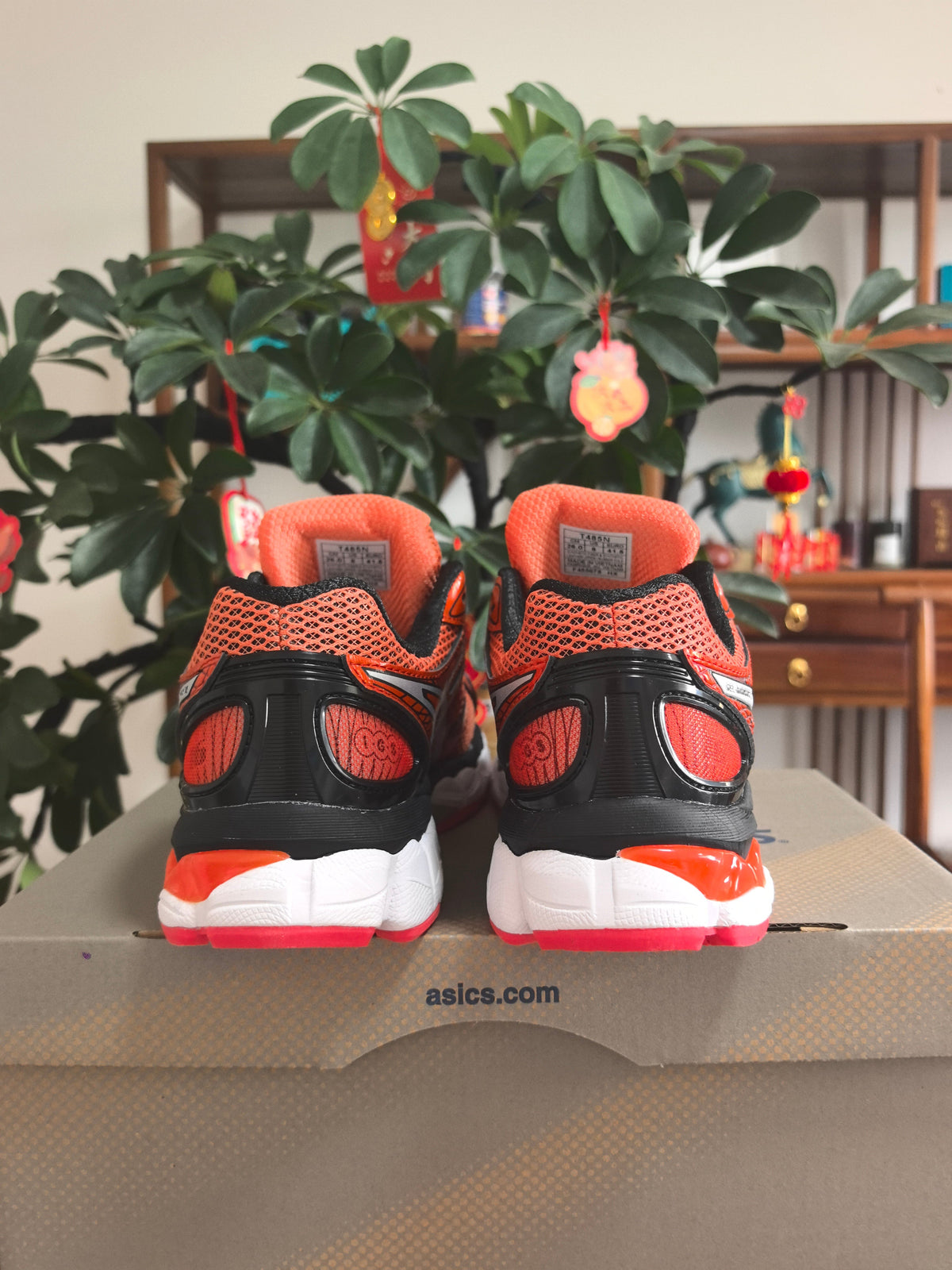 ASICS GEL-KAYANO 14 Sneakers in Orange and Pink - product image from the listing.