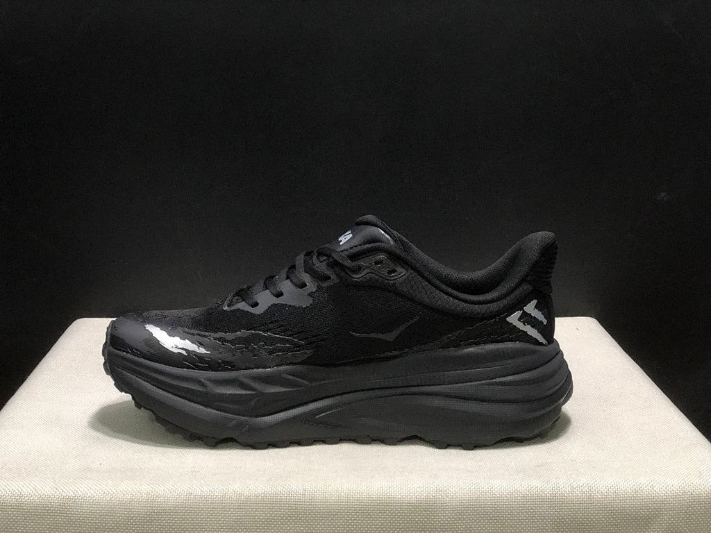 HOKA Stinson 7 Black Trail Trainers - product image from the listing.