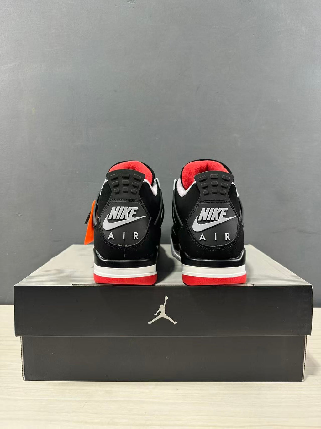 Air Jordan 4 Retro Bred Black Red Sneakers IX8180-001 - product image from the listing.