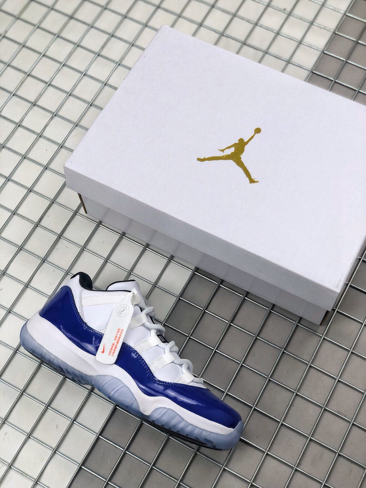 Air Jordan 11 Sneakers in White and Deep Blue BQ3685-001 - product image from the listing.