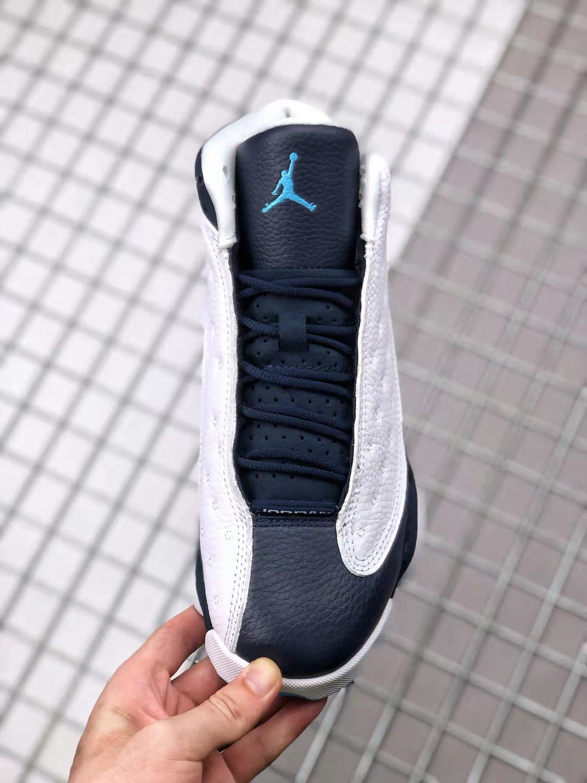 Air Jordan 13 Obsidian Sneakers 414571-144 - product image from the listing.
