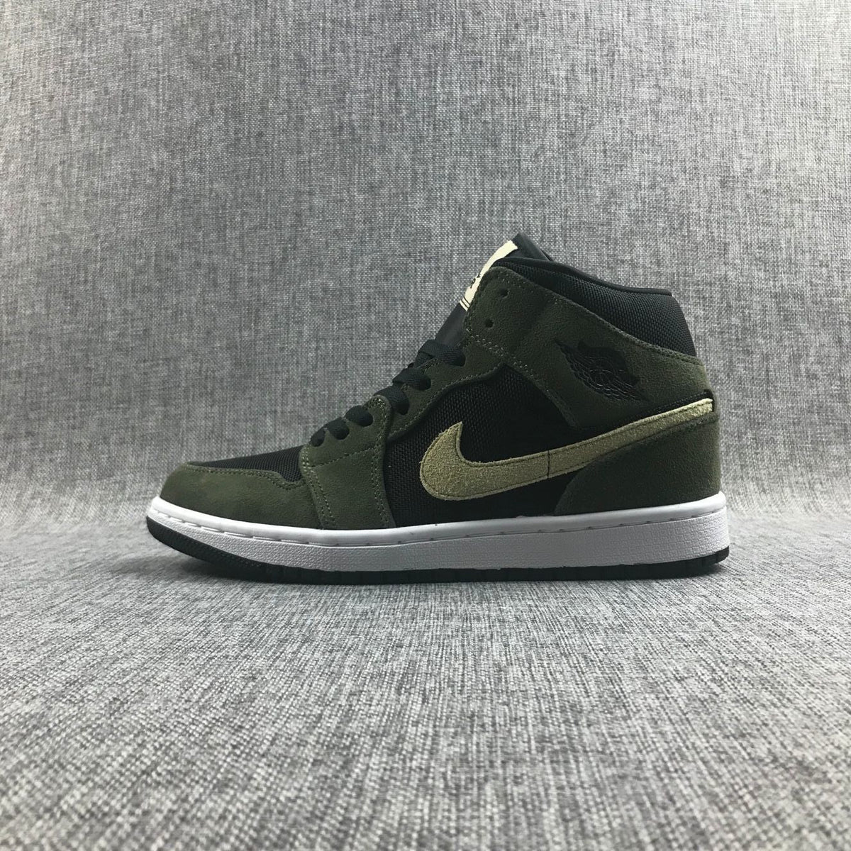 Air Jordan 1 Mid Sneakers in Olive Green BQ6472-030 - product image from the listing.