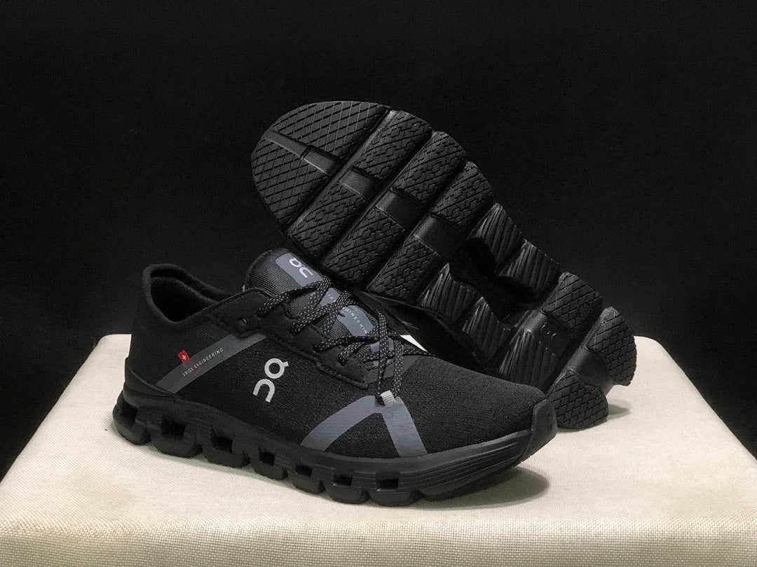 On Cloud X 4 AD Sneakers in Black - product image from the listing.
