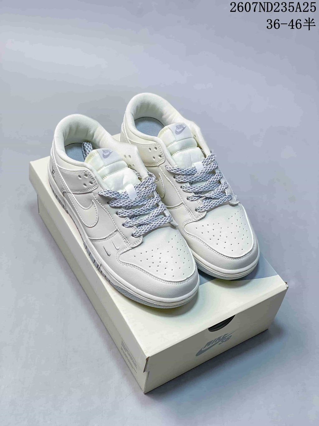Nike SB Dunk Low Pro Sneakers in White Grey 2607ND235A25 - product image from the listing.