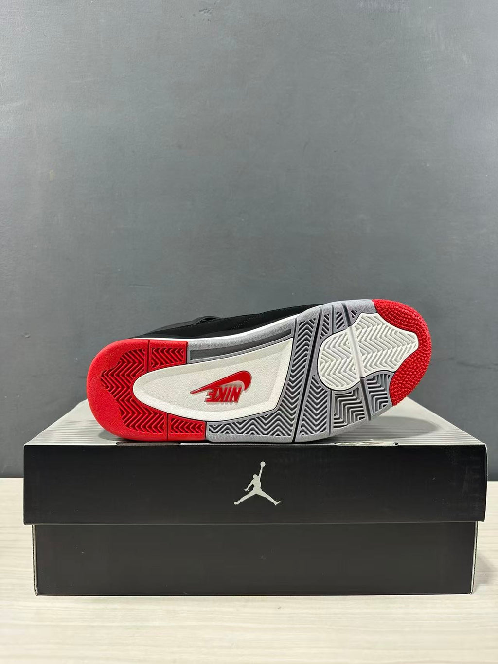 Air Jordan 4 Retro Bred Black Red Sneakers IX8180-001 - product image from the listing.