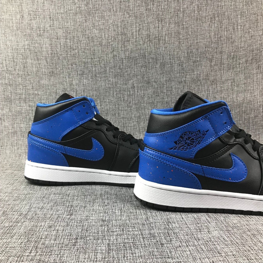 Air Jordan 1 Mid High-Top Sneakers in Black and Blue - product image from the listing.