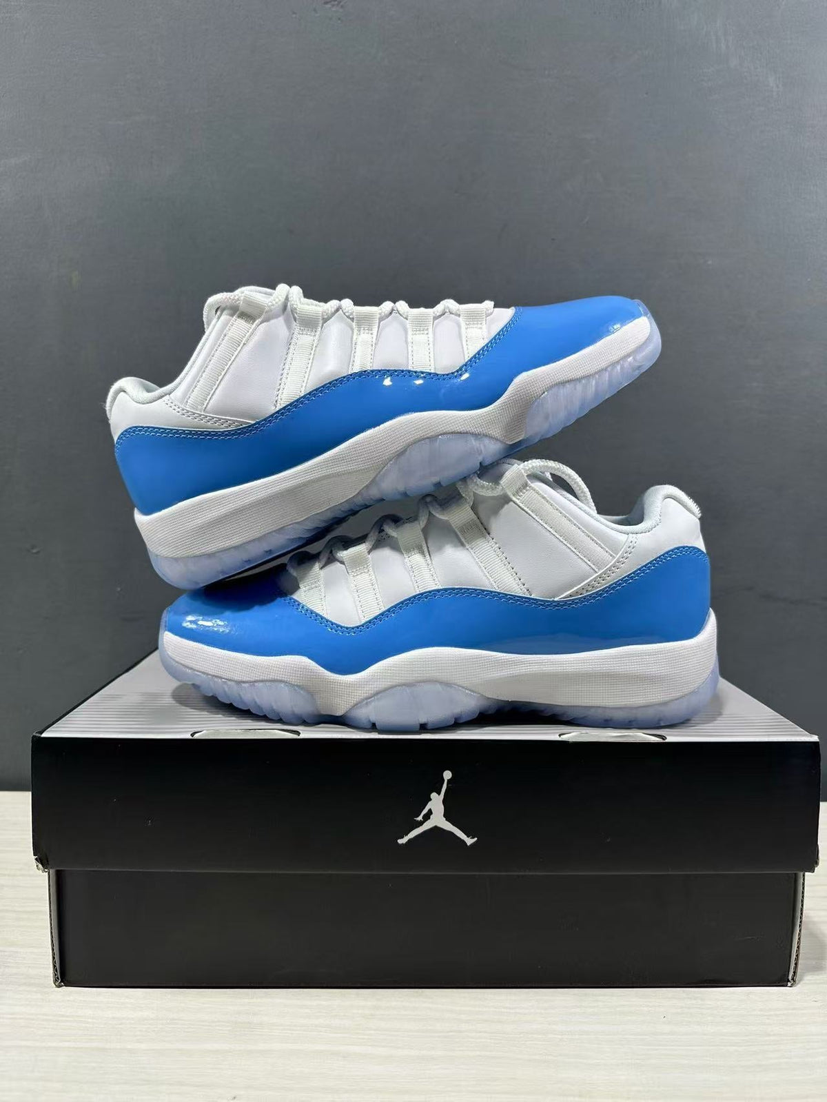 Air Jordan 11 Retro Low UNC Blue Sneakers FV5104-100 - product image from the listing.