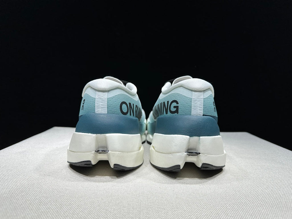 On Cloudboom Max Running Shoes in White and Lake in Blue - product image from the listing.