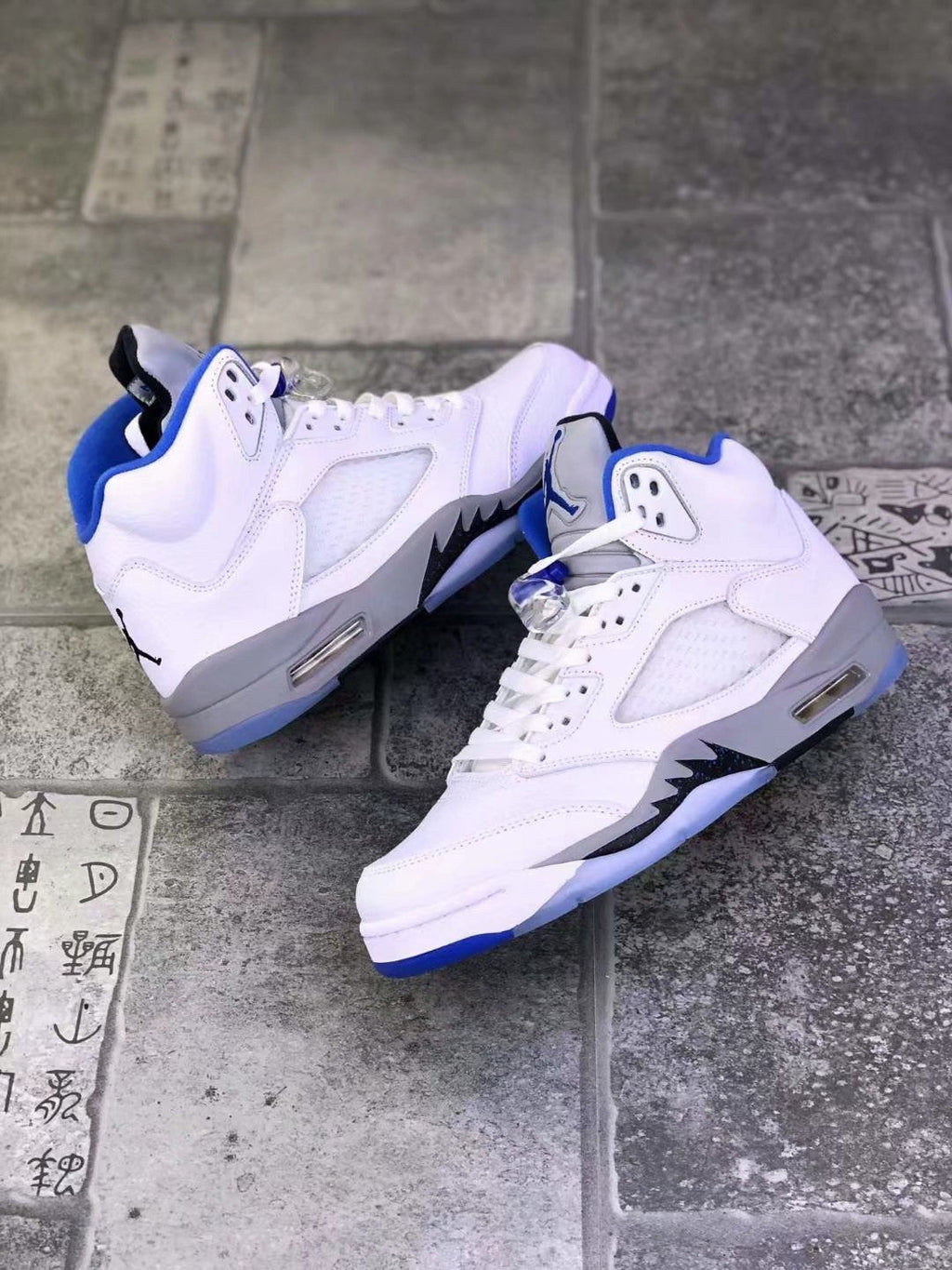 Air Jordan 5 Stealth 2.0 Sneakers in White Blue 440888-140 - product image from the listing.