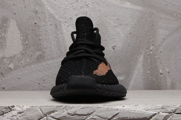 Yeezy Boost 350 V2 Sneakers in Black and Tan - product image from the listing.