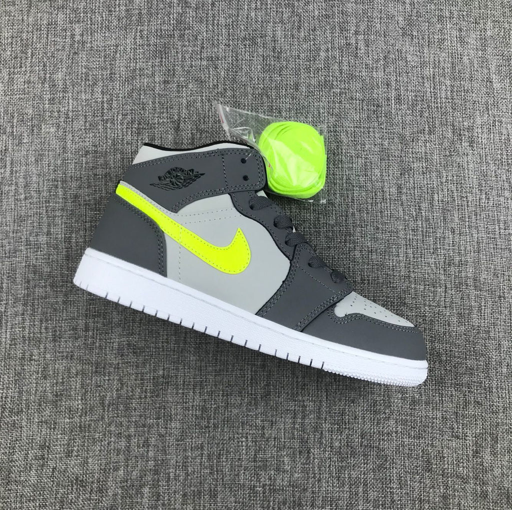 Air Jordan 1 Mid Sneakers in Grey Volt 554724-072 - product image from the listing.