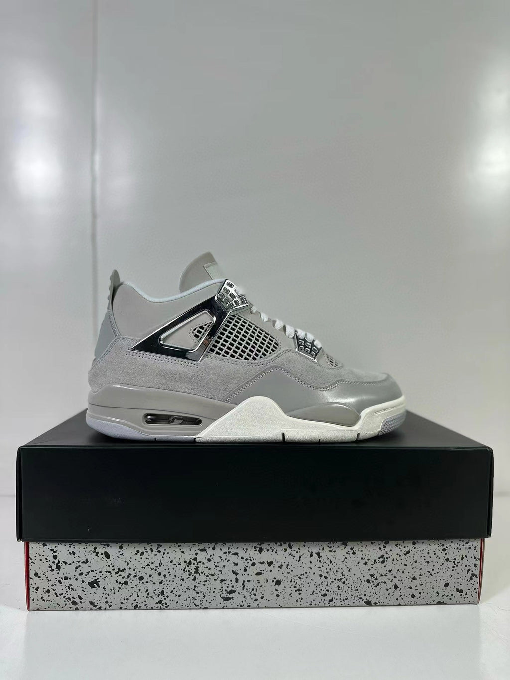 Air Jordan 4 Light Iron Ore Frozen Moments Sneakers - product image from the listing.