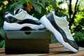 Air Jordan 11 Retro Low Sneakers, White and Navy - product image from the listing.
