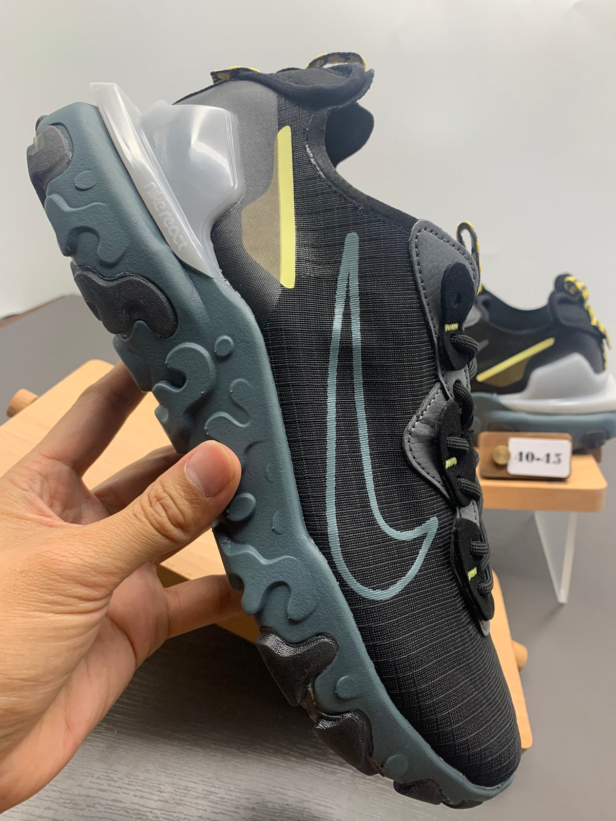 Nike React Black and Grey Trainers with Blue Accents - product image from the listing.