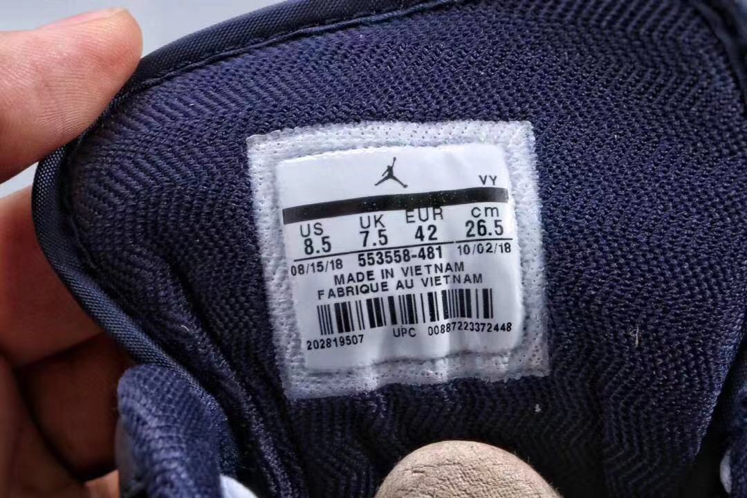 Jordan 1 Low Sneakers in Midnight Navy White Red - product image from the listing.