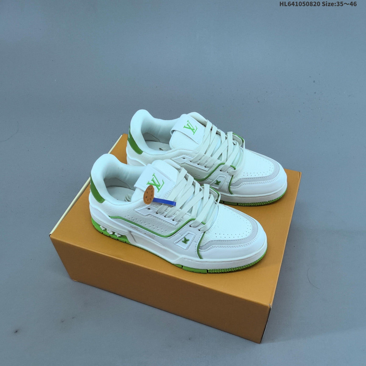 Louis Vuitton Trainer Low-Top Sneakers, in White and Green/Blue - product image from the listing.