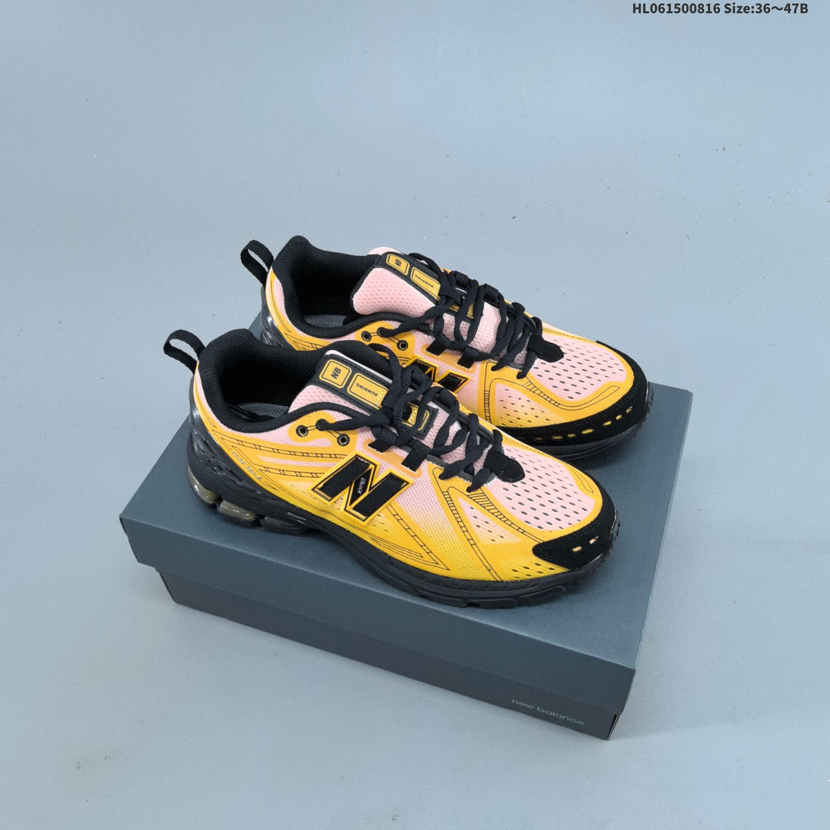 New Balance M1906R Sneakers in Pink Yellow Black U1906596 - product image from the listing.