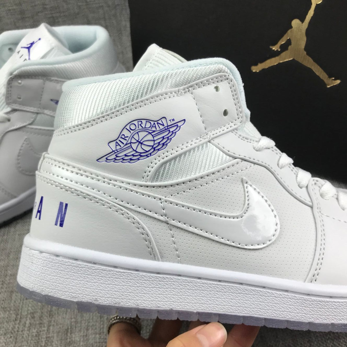 White Sneakers with Translucent Outsole - Air Jordan 1 Mid - product image from the listing.