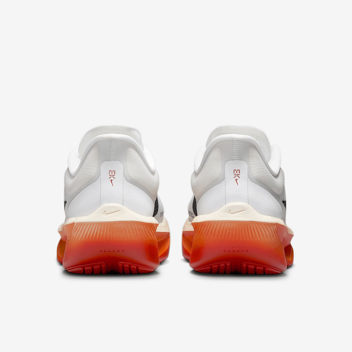 Nike ZoomX Running Shoes in White Black Orange - product image from the listing.