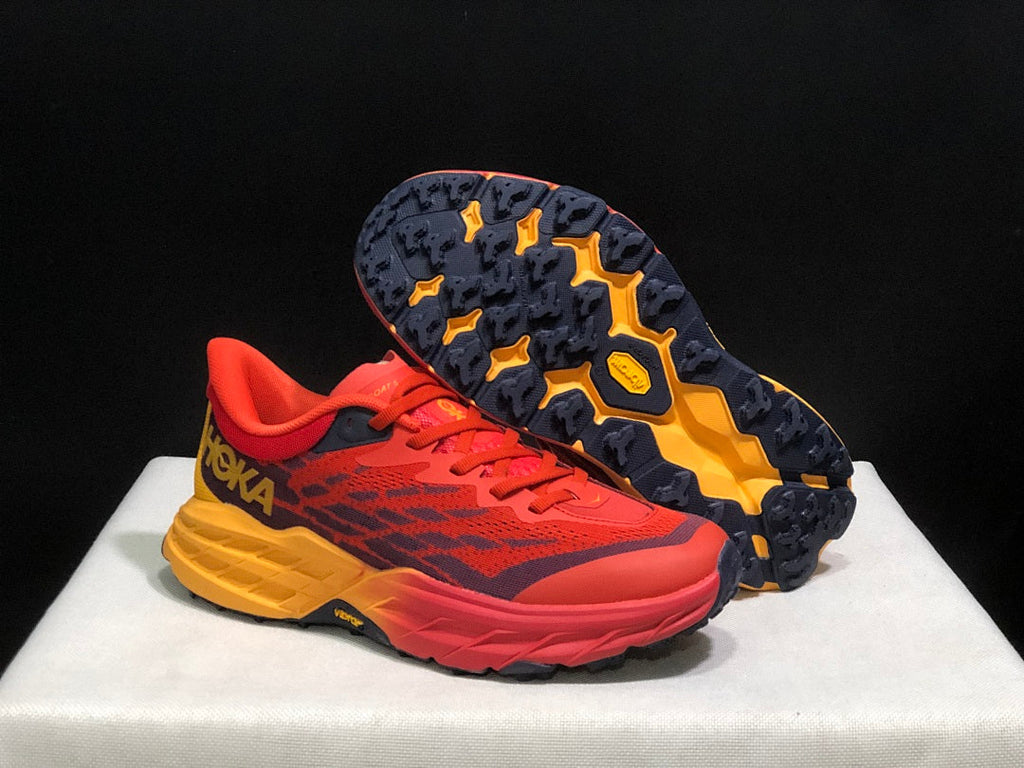 HOKA Speedgoat 5 Trail Running Shoes in Red and Yellow - product image from the listing.