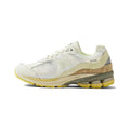 White and Yellow New Balance 2002R Sneakers - product image from the listing.