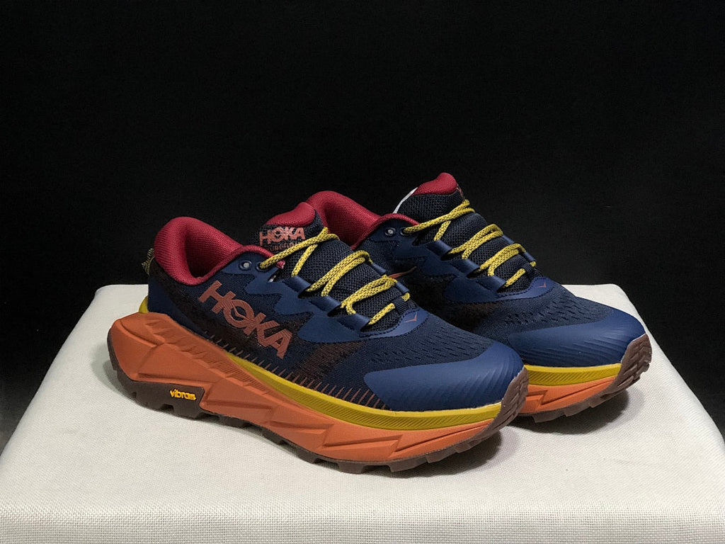HOKA Skyline Float X Trail Sneakers in Navy Orange - product image from the listing.