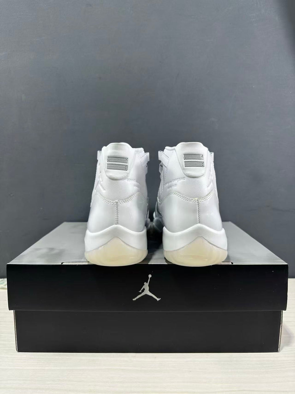 Air Jordan 11 Comme des Garçons White Sneakers IV7639-100 - product image from the listing.
