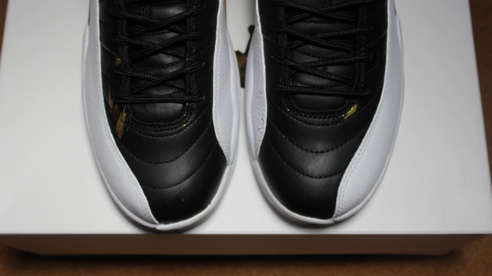 Air Jordan 12 Wings Black White Gold Sneakers 848692-033 - product image from the listing.