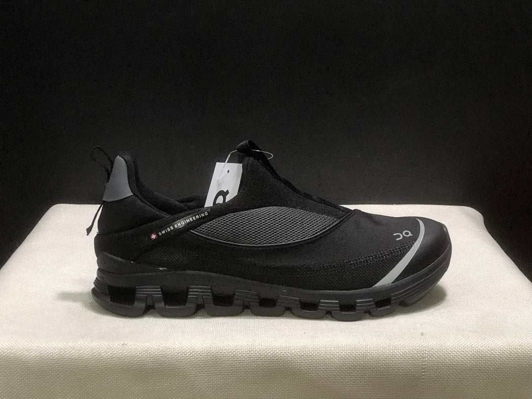 On Cloud 4 Coast Black Slip-On Trainers - product image from the listing.