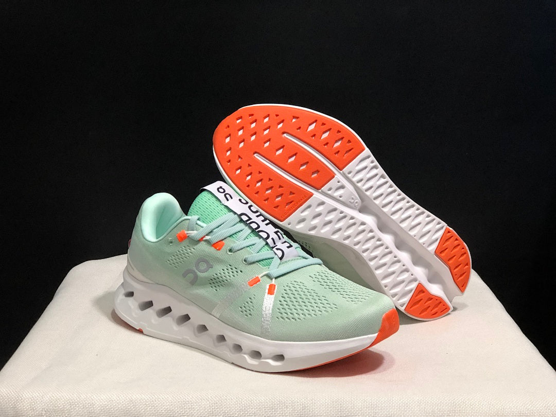 Pale Green and White On Cloudsurfer Sneakers - product image from the listing.