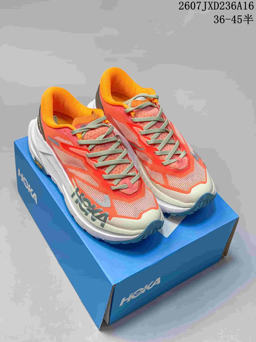 Hoka MAFATE X Trail Running Shoes in Coral and Yellow - product image from the listing.