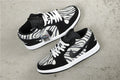 Air Jordan 1 Mid Zebra Print Sneakers Black White - product image from the listing.