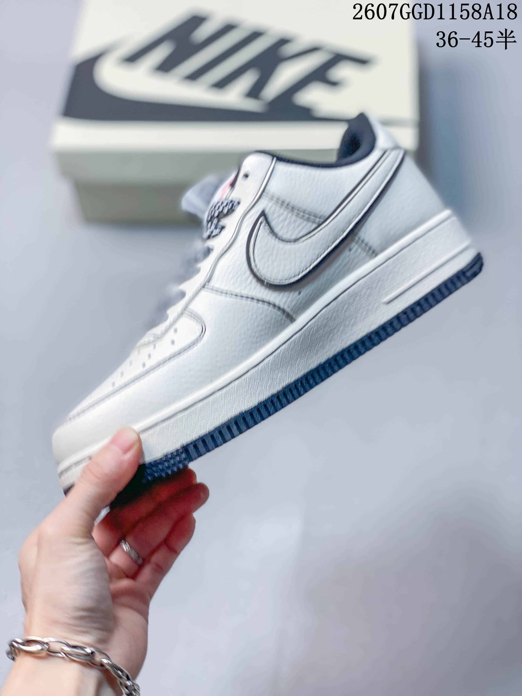 Nike Air Force 1 '07 Low-Top Sneakers in White Navy - product image from the listing.