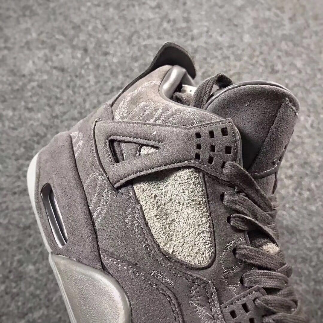 Grey Jordan 4 KAWS Sample High-Top Sneakers - product image from the listing.