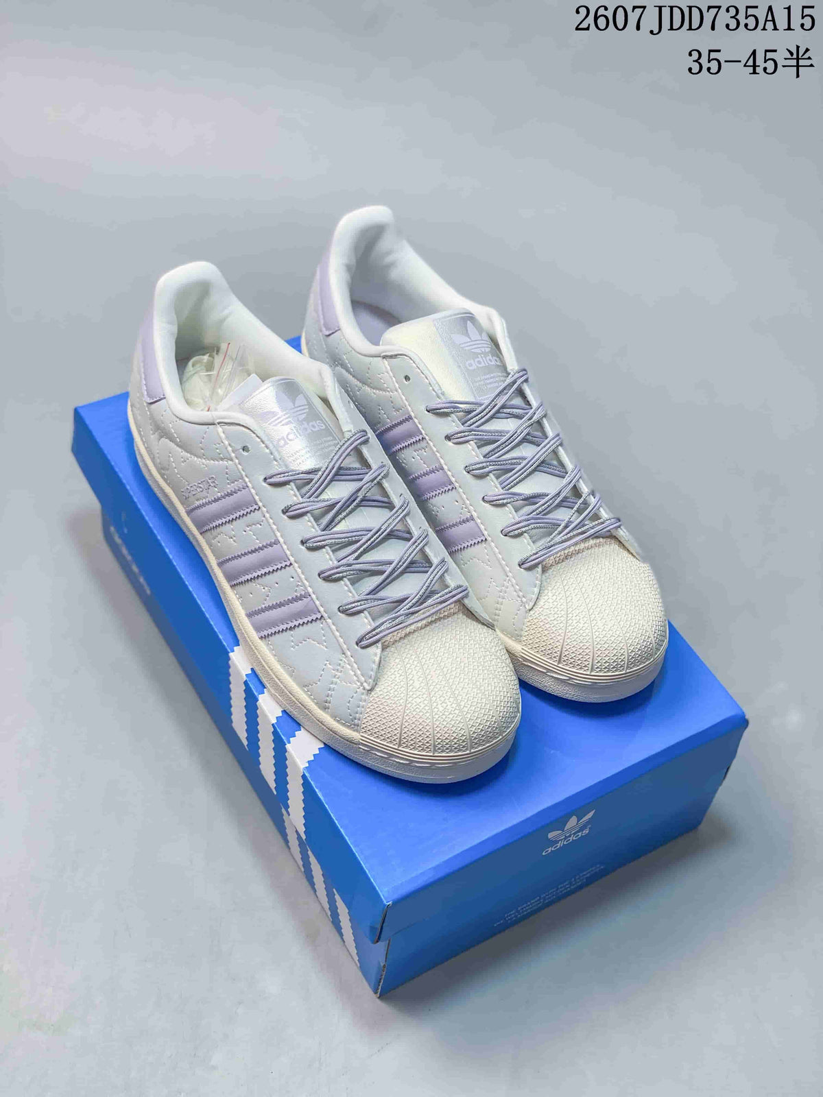 adidas Superstar White and Lavender Shell-Toe Trainers - product image from the listing.