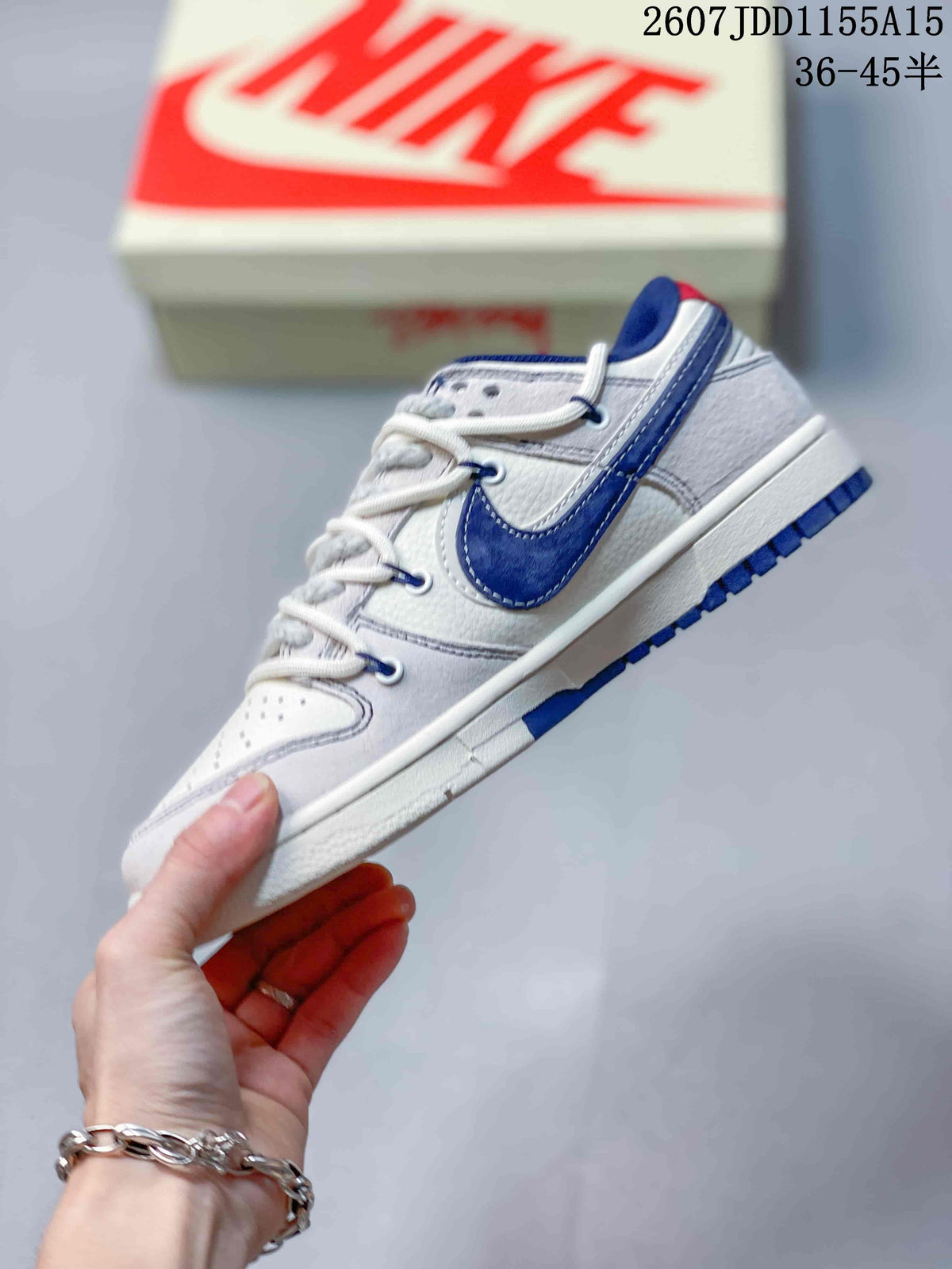 Nike SB Dunk Low Stussy Sneakers in White Grey Navy - product image from the listing.