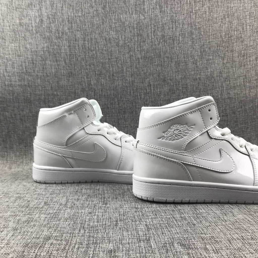 Air Jordan 1 Mid White Patent-Style Sneakers BQ6472-111 - product image from the listing.