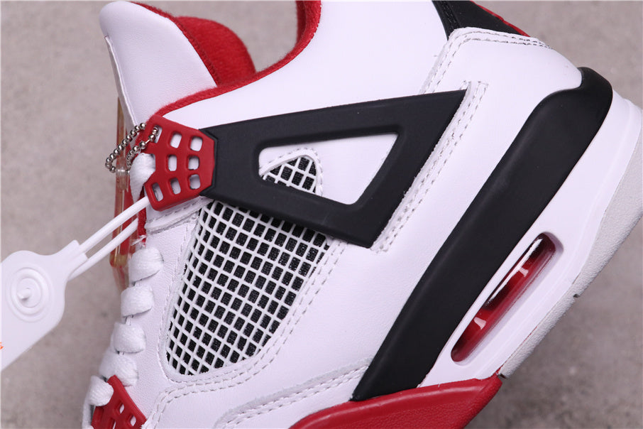 Air Jordan 4 Retro White Red Black Sneakers - product image from the listing.