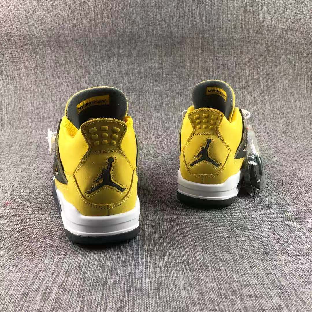 Air Jordan 4 Lightning Yellow Black Sneakers - product image from the listing.