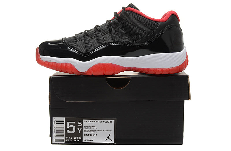 Air Jordan 11 Retro Low Black Red Sneakers - product image from the listing.