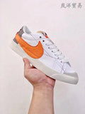 Nike Blazer Low '77 Sneakers in White Orange - product image from the listing.
