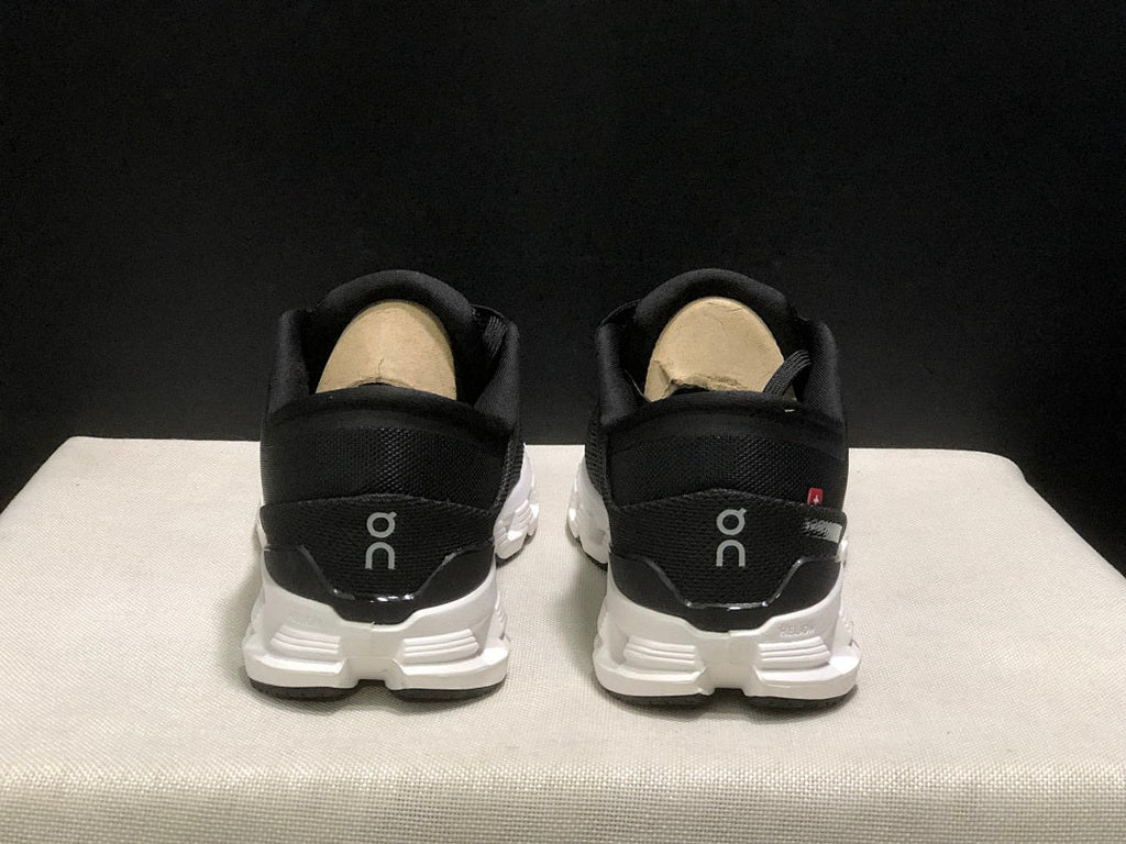 On Cloud X 4 Sneakers in Black and White - product image from the listing.