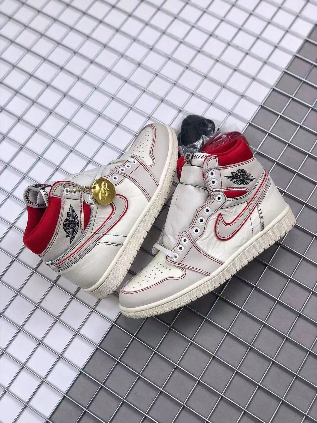 Air Jordan 1 Retro High OG Sneakers in White and Red - product image from the listing.